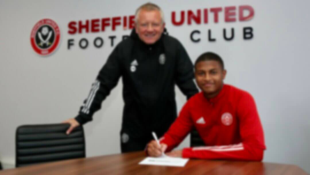 rhian signing for Sheffield